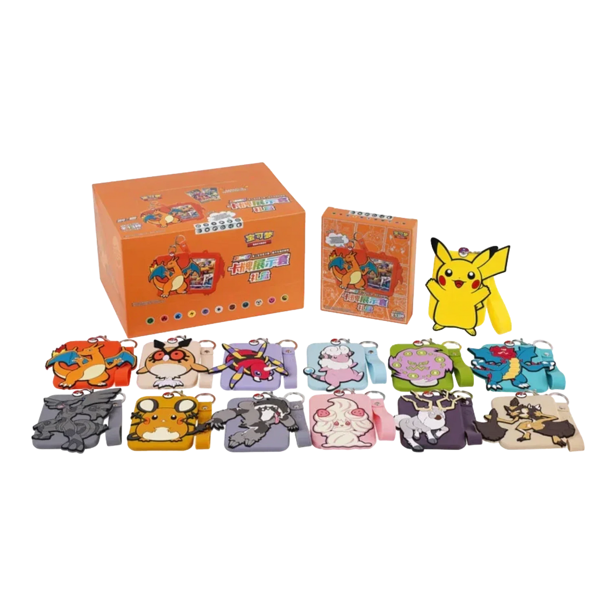 Pokémon silicone card holders with character keychains, wrist straps and display boxes laid out