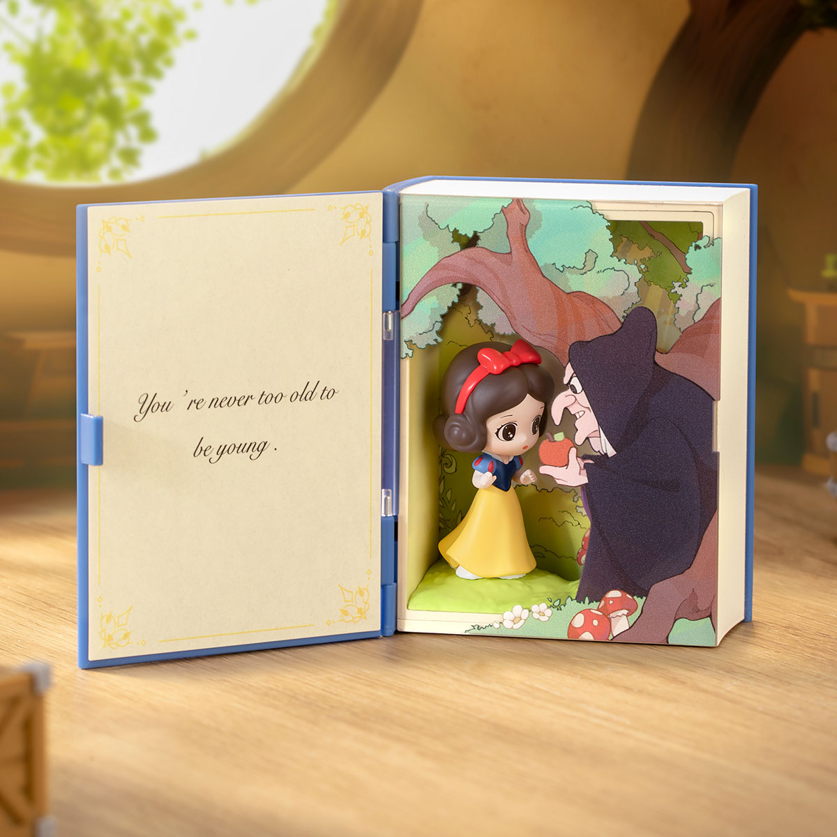 Snow White storybook scene set open on display, from the POP MART Disney Princess's Fairy Tales blind box series